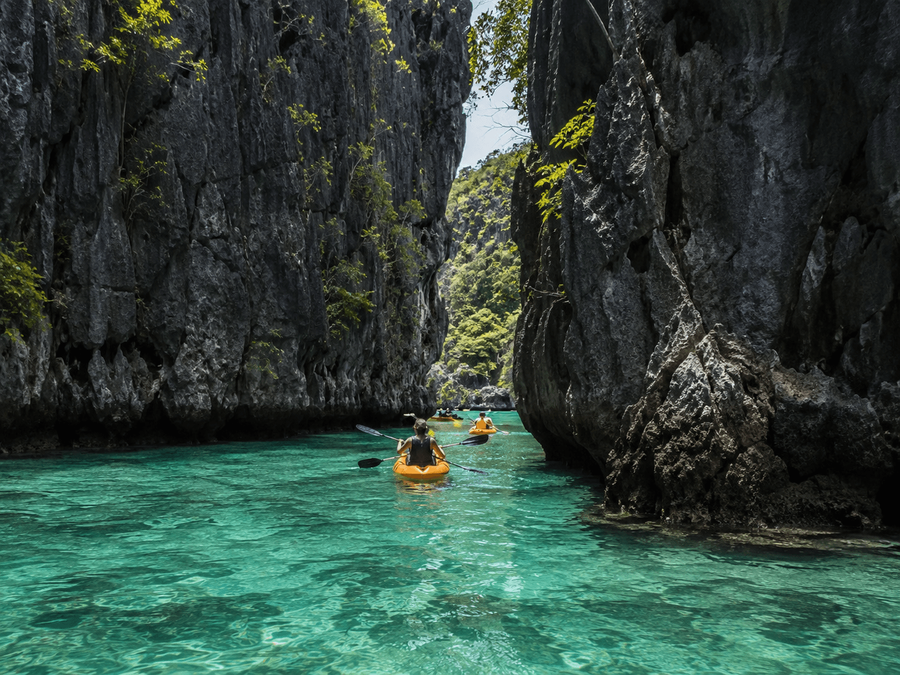 Kayaking through limestone cliffs