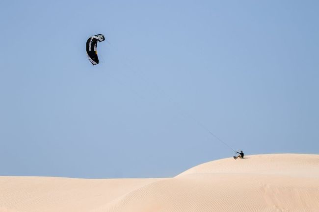 Parasailing over Desert Dunes