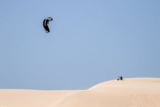 Parasailing over Desert Dunes